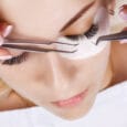 Eyelash Extension Procedure. Woman Eye with Long Eyelashes. Lashes. Close up, macro, selective focus
